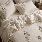 Fiorella beige duvet cover set with floral embroidery and ruffled hems